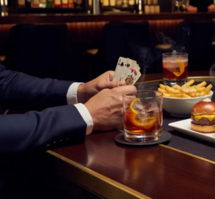 Food and drinks served beside poker tables at Uty Care For You.